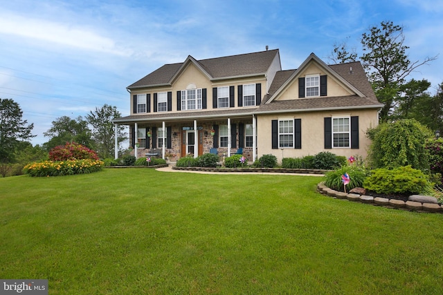 366 High St, Souderton, PA 18964 - colonial inspired home featuring stucco siding, a porch, and a front lawn