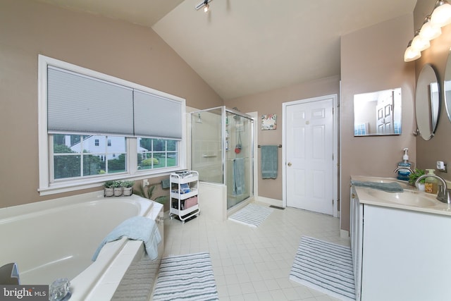 366 High St, Souderton, PA 18964 - full bath with heating unit, a shower stall, a garden tub, double vanity, and tile patterned flooring