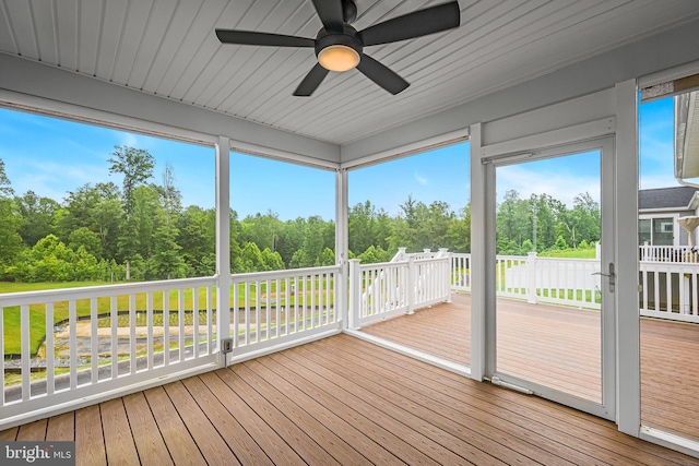 11466 Mesa Verde Ct, White Plains, MD 20695 - unfurnished sunroom with a ceiling fan, view of scattered trees, and plenty of natural light