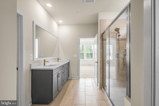 11466 Mesa Verde Ct, White Plains, MD 20695 - full bathroom with double vanity, a shower stall, and recessed lighting