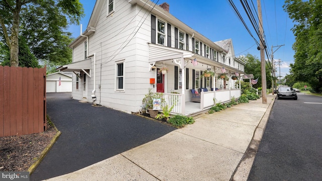 16 E Jefferson St, Newtown, PA 18940 - view of front of property featuring a porch and a chimney