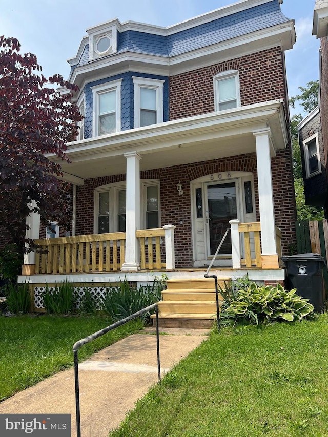 508 W 25th St, Wilmington, DE 19802 - view of front facade featuring brick siding, a porch, and mansard roof