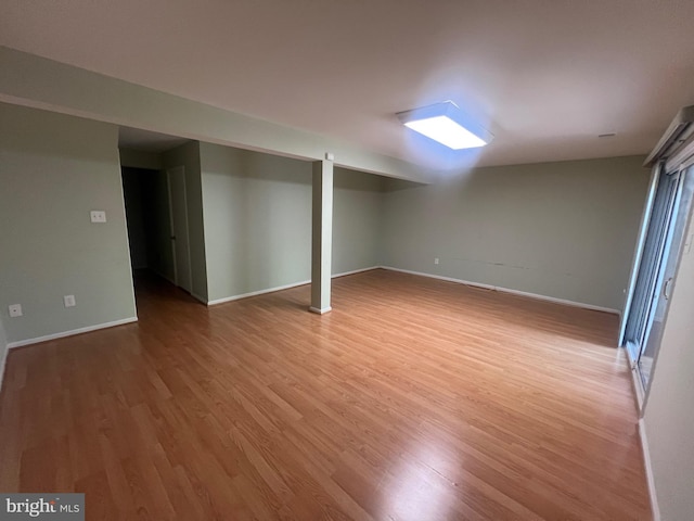 11708 Lone Tree Ct, Columbia, MD 21044 - finished basement featuring light wood-style floors and baseboards
