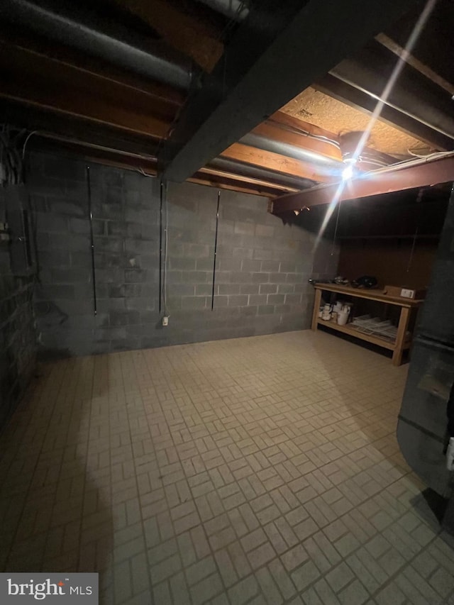 11708 Lone Tree Ct, Columbia, MD 21044 - unfinished basement featuring brick patterned floors