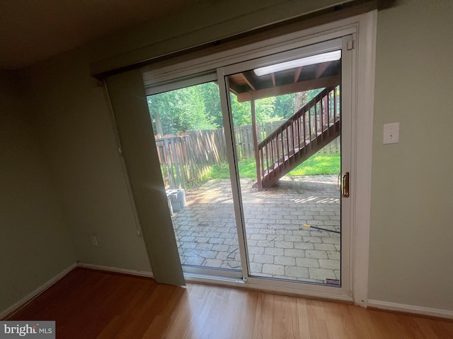 11708 Lone Tree Ct, Columbia, MD 21044 - doorway to outside with wood finished floors and baseboards