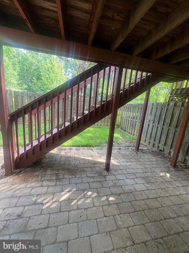 11708 Lone Tree Ct, Columbia, MD 21044 - fenced backyard featuring stairway and a patio area
