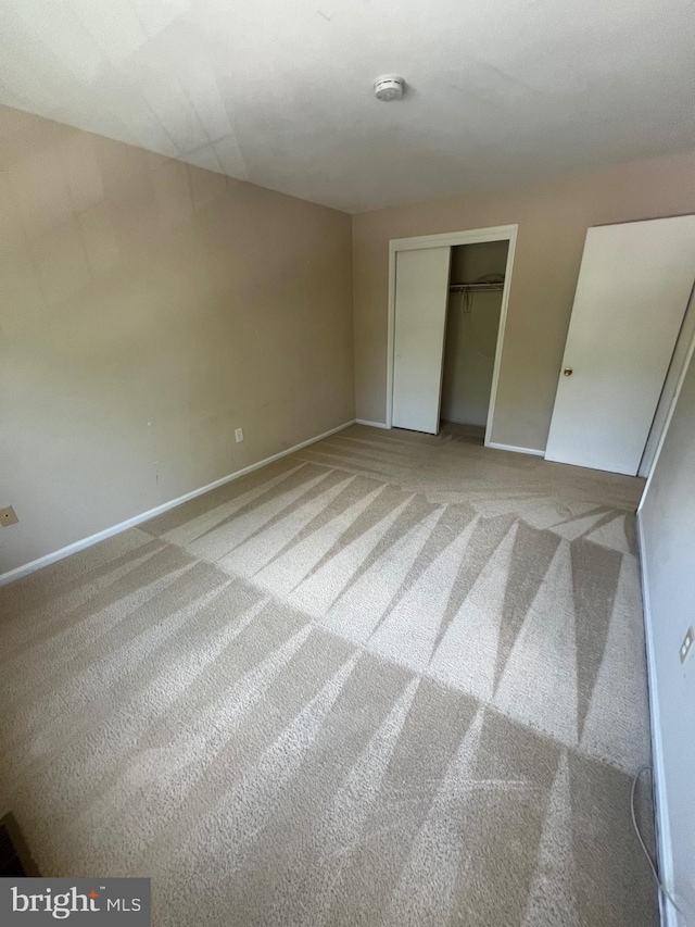 11708 Lone Tree Ct, Columbia, MD 21044 - unfurnished bedroom featuring carpet and a closet