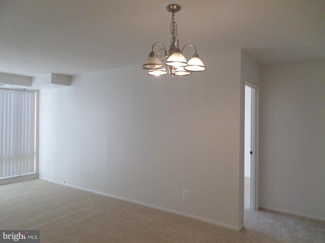 9900 Georgia Ave Unit 707, Silver Spring, MD 20902 - unfurnished room with light colored carpet and a chandelier