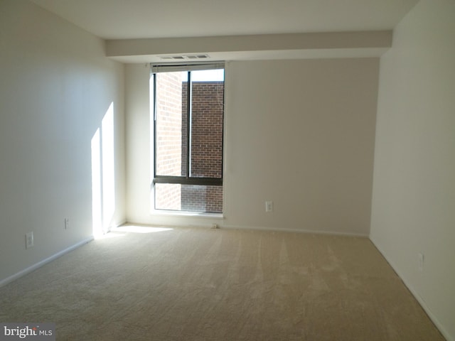 9900 Georgia Ave Unit 707, Silver Spring, MD 20902 - carpeted spare room with baseboards
