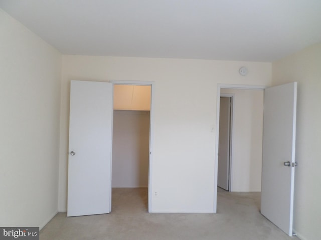 9900 Georgia Ave Unit 707, Silver Spring, MD 20902 - unfurnished bedroom with light carpet and a spacious closet