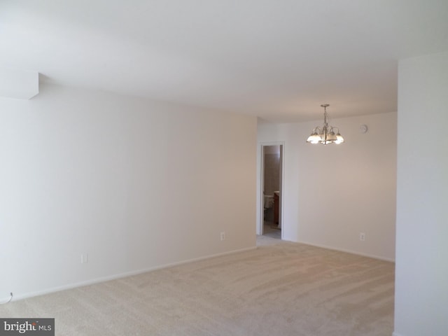 9900 Georgia Ave Unit 707, Silver Spring, MD 20902 - unfurnished room featuring a chandelier and light carpet