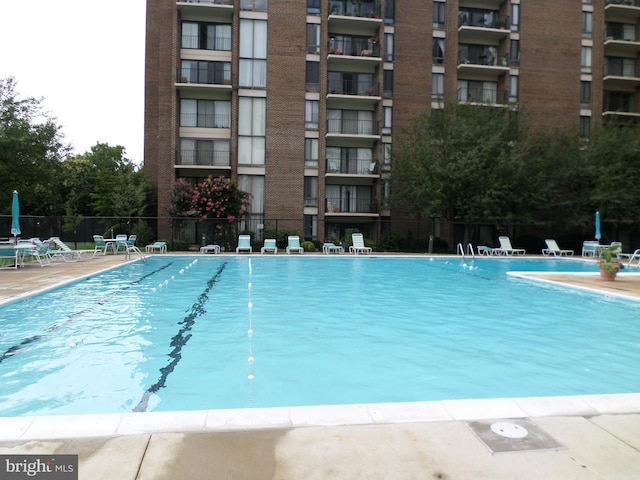 9900 Georgia Ave Unit 707, Silver Spring, MD 20902 - community pool featuring a patio area
