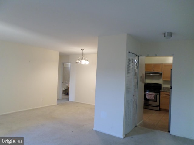 9900 Georgia Ave Unit 707, Silver Spring, MD 20902 - empty room with a chandelier and light colored carpet