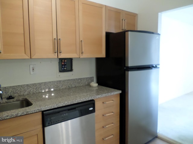 9900 Georgia Ave Unit 707, Silver Spring, MD 20902 - kitchen with appliances with stainless steel finishes, light brown cabinetry, and light stone counters