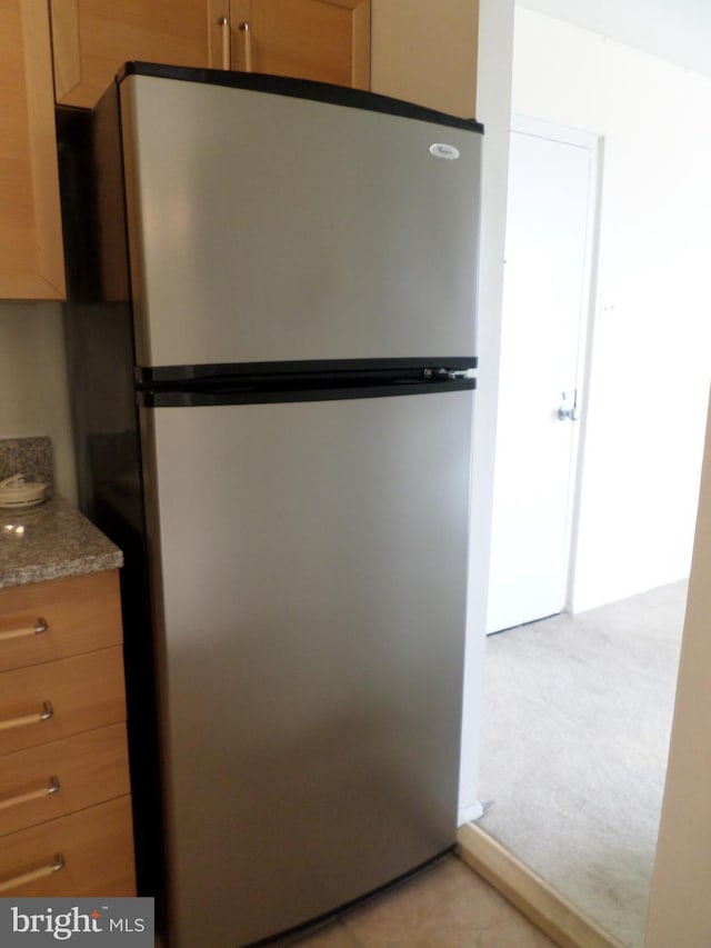 9900 Georgia Ave Unit 707, Silver Spring, MD 20902 - kitchen with freestanding refrigerator and light colored carpet