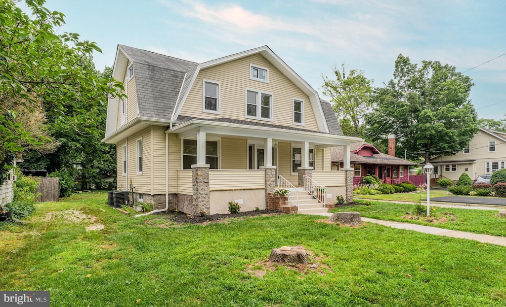 36 Columbia Ave, Vineland, NJ 08360 - dutch colonial with a gambrel roof, a porch, a front yard, and a shingled roof