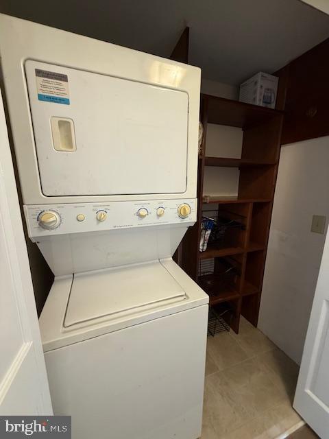 203 W Weymouth Rd, Vineland, NJ 08360 - laundry room featuring estacked washer and dryer and light tile patterned floors