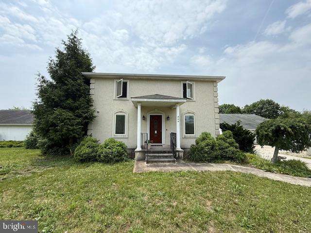 203 W Weymouth Rd, Vineland, NJ 08360 - traditional home featuring a front yard and stucco siding