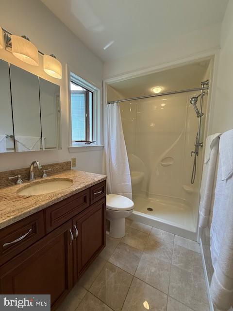203 W Weymouth Rd, Vineland, NJ 08360 - bathroom featuring vanity, a shower with shower curtain, and tile patterned floors