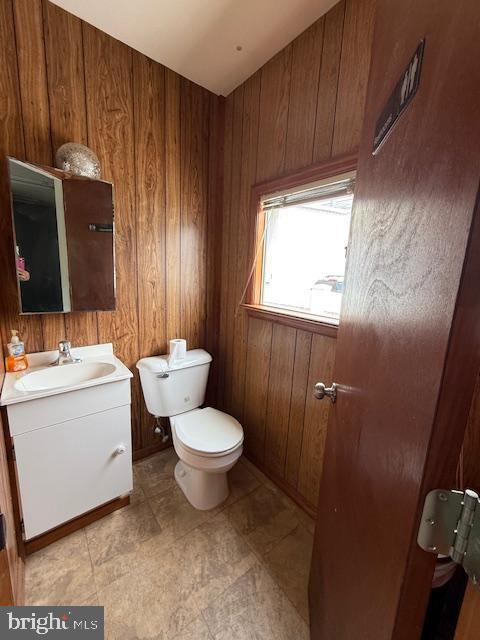 203 W Weymouth Rd, Vineland, NJ 08360 - bathroom featuring vanity and wooden walls