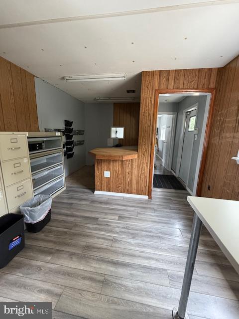 203 W Weymouth Rd, Vineland, NJ 08360 - kitchen with wood finished floors and wooden walls