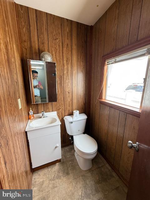 203 W Weymouth Rd, Vineland, NJ 08360 - half bathroom with vanity and wood walls