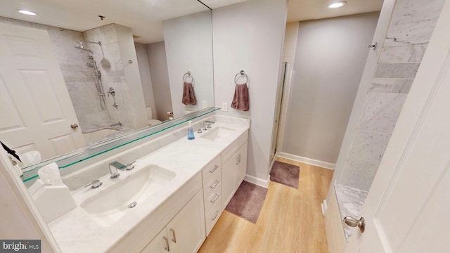 960 Fell St Unit 609, Baltimore, MD 21231 - full bath featuring wood finished floors, double vanity, recessed lighting, and shower / tub combination