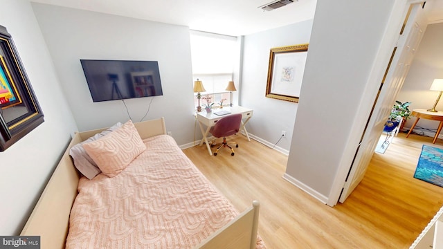 960 Fell St Unit 609, Baltimore, MD 21231 - bedroom with wood finished floors and a desk