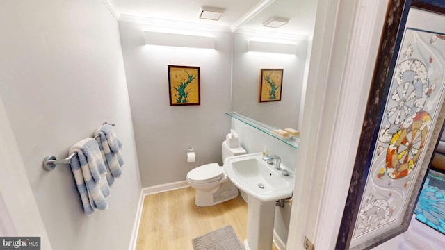 960 Fell St Unit 609, Baltimore, MD 21231 - half bath featuring crown molding and wood finished floors