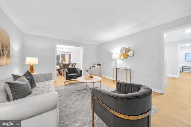 12779 Lost Creek Ct, Manassas, VA 20112 - living area with light wood-style floors, a chandelier, and ornamental molding