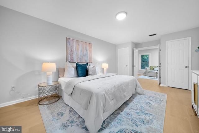 12779 Lost Creek Ct, Manassas, VA 20112 - bedroom featuring baseboards and light wood-style flooring