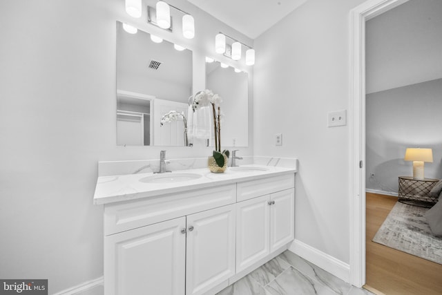 12779 Lost Creek Ct, Manassas, VA 20112 - bathroom featuring double vanity and marble look tiles