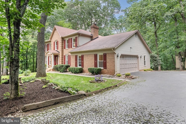 12779 Lost Creek Ct, Manassas, VA 20112 - colonial inspired home with brick siding, a chimney, asphalt driveway, and an attached garage
