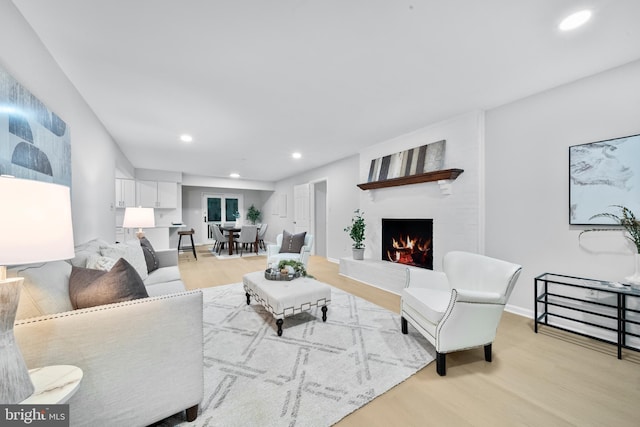 12779 Lost Creek Ct, Manassas, VA 20112 - living area with light wood-type flooring, recessed lighting, and a fireplace