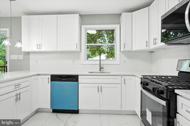 9884 Bird River Rd, Baltimore, MD 21220 - kitchen featuring appliances with stainless steel finishes, light marble finish floors, plenty of natural light, and light countertops