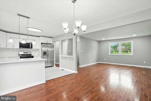 9884 Bird River Rd, Baltimore, MD 21220 - kitchen featuring appliances with stainless steel finishes, light countertops, open floor plan, and white cabinets