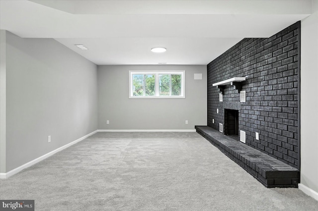 9884 Bird River Rd, Baltimore, MD 21220 - unfurnished living room featuring carpet and a brick fireplace