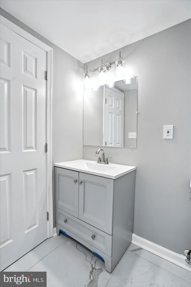 9884 Bird River Rd, Baltimore, MD 21220 - bathroom featuring vanity and marble look tile flooring