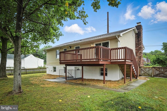 9884 Bird River Rd, Baltimore, MD 21220 - back of property with a wooden deck, stairway, a chimney, and a gate