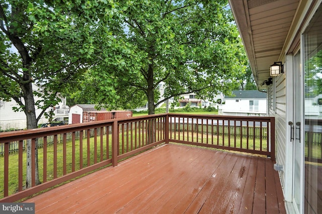 9884 Bird River Rd, Baltimore, MD 21220 - wooden terrace featuring a residential view and a lawn