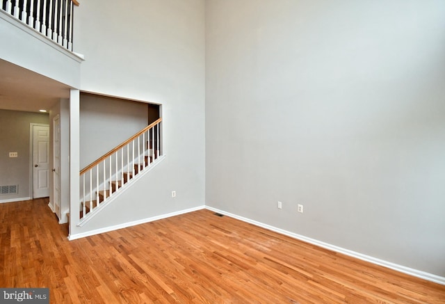 316 Wheatfield Cir, Hatfield, PA 19440 - spare room with light wood-style flooring, stairs, and a high ceiling