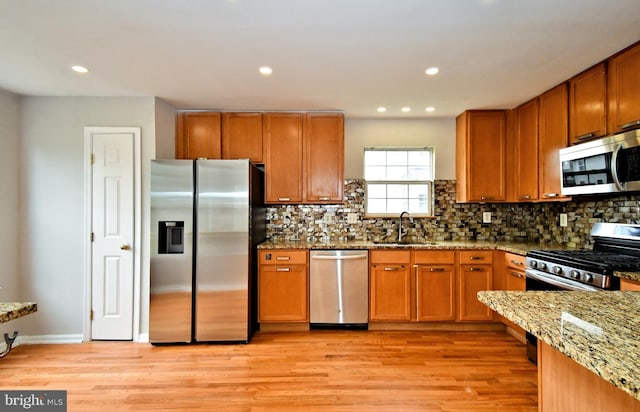 316 Wheatfield Cir, Hatfield, PA 19440 - kitchen with appliances with stainless steel finishes, light wood-type flooring, brown cabinets, and recessed lighting