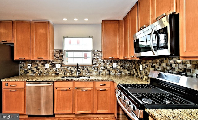 316 Wheatfield Cir, Hatfield, PA 19440 - kitchen with stainless steel appliances, light stone counters, decorative backsplash, and recessed lighting
