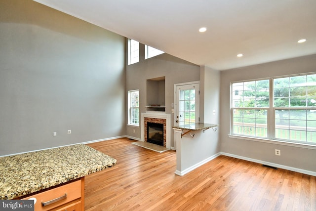 316 Wheatfield Cir, Hatfield, PA 19440 - living area with light wood-type flooring, a fireplace with raised hearth, and recessed lighting