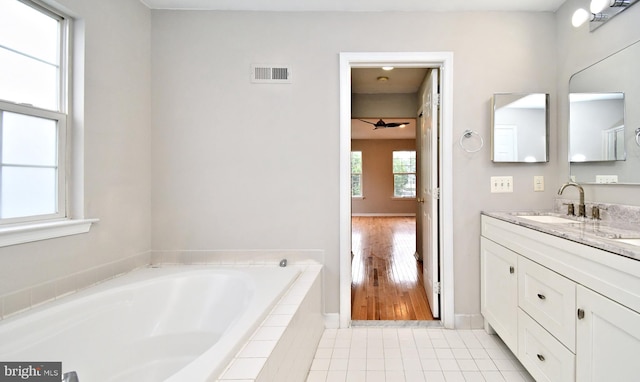 316 Wheatfield Cir, Hatfield, PA 19440 - bathroom featuring vanity, a garden tub, and tile patterned floors