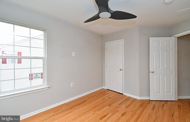 316 Wheatfield Cir, Hatfield, PA 19440 - unfurnished bedroom with light wood finished floors, multiple windows, and ceiling fan