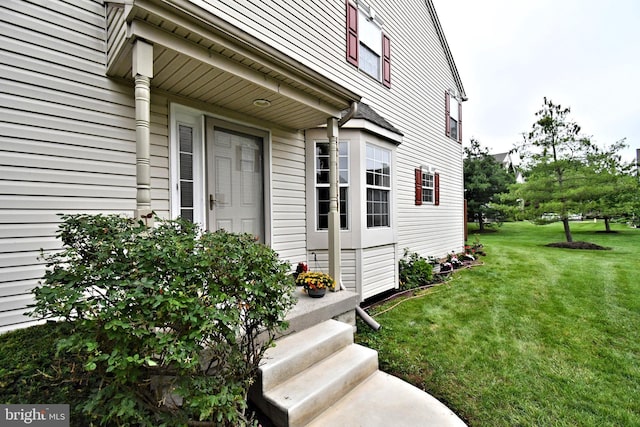 316 Wheatfield Cir, Hatfield, PA 19440 - view of exterior entry with a yard