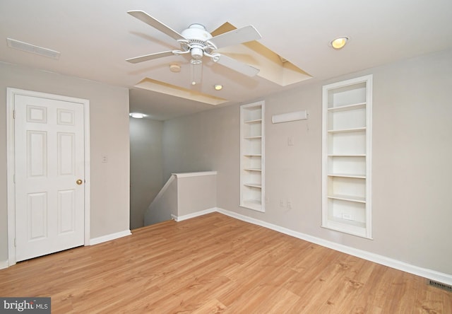 316 Wheatfield Cir, Hatfield, PA 19440 - empty room with built in shelves, wood finished floors, ceiling fan, and recessed lighting