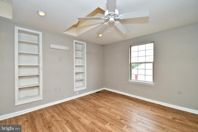 316 Wheatfield Cir, Hatfield, PA 19440 - empty room with built in features, wood finished floors, and a ceiling fan