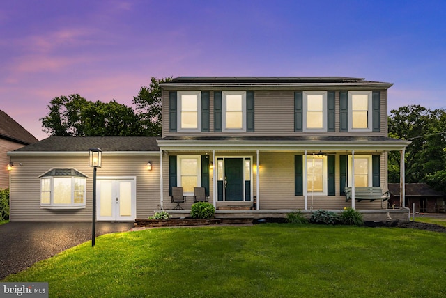 613 Main St, Langhorne, PA 19047 - view of front of property featuring a porch, a lawn, and french doors
